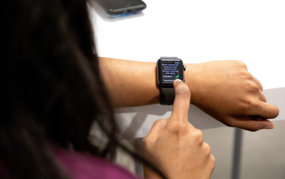 Image of girl looking at smart watch