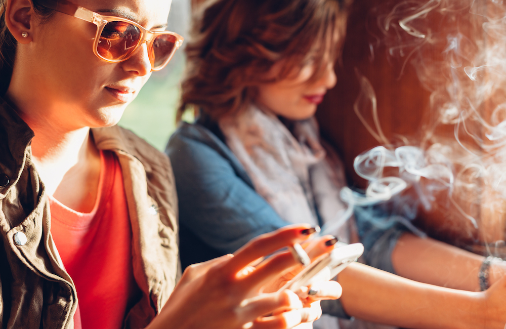 image of young woman smoking a cigarette